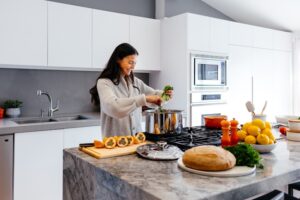 Beginner learning basic cooking skills in a modern kitchen 2025