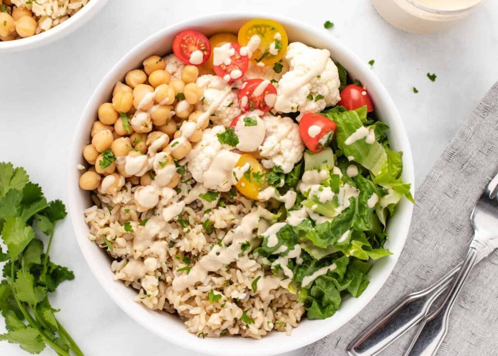 Budget-friendly healthy lunch idea with rice, chickpeas, and mixed vegetables.