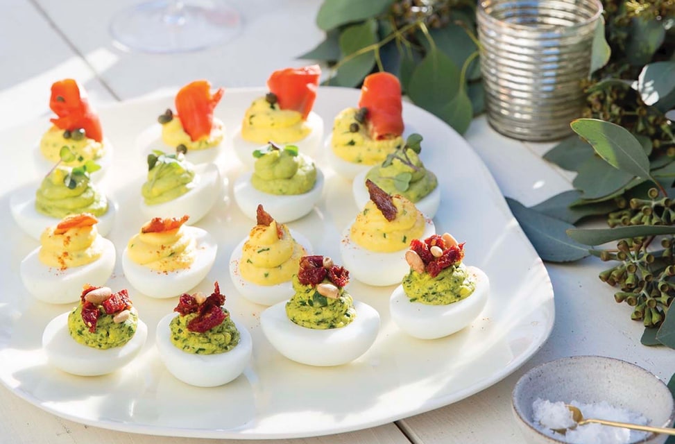 Classic deviled eggs with avocado and smoked salmon – protein appetizers